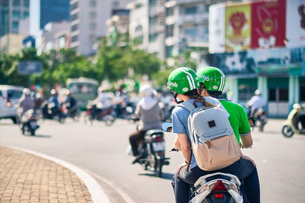 A traveler using a Grab motorbike service in Hanoi