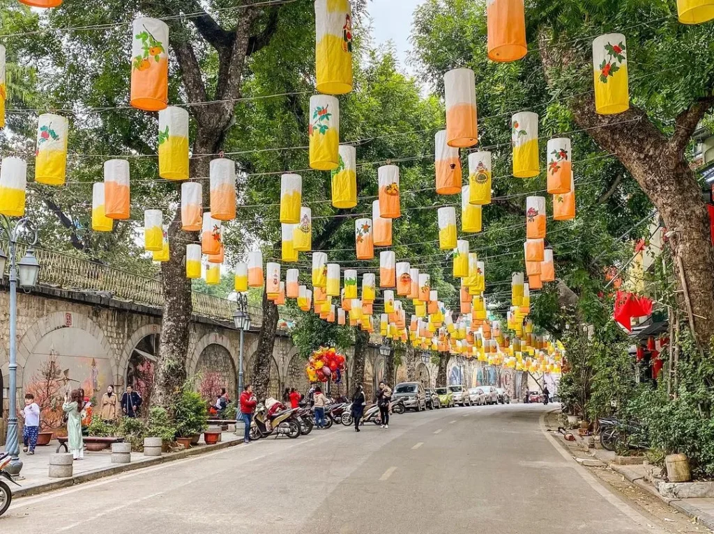 Vibrant murals on Phung Hung Street illustrating old Hanoi